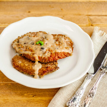 Two Chicken Fried steaks with mushroom gravy.