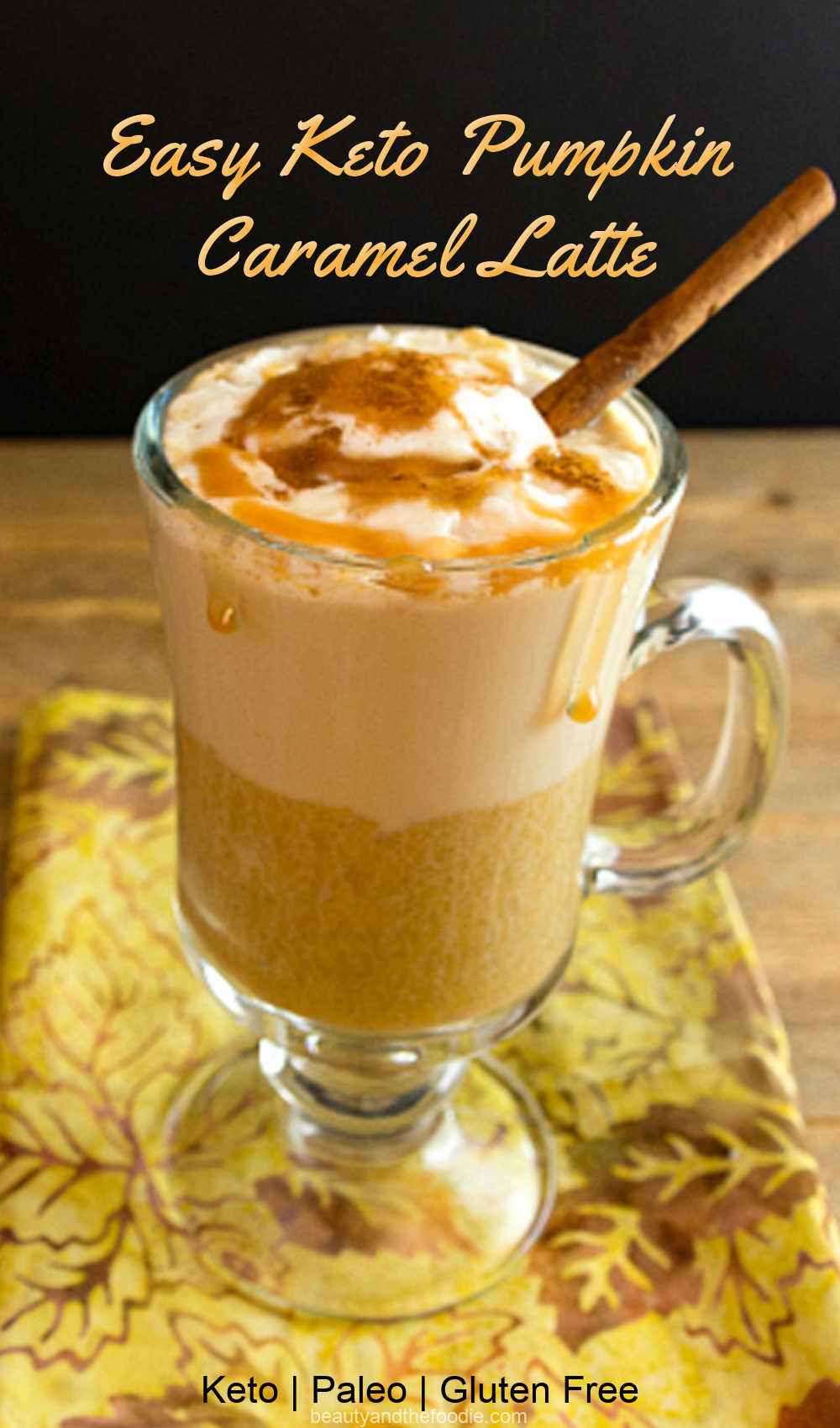 A glass of pumpki latte with caramel sauce.