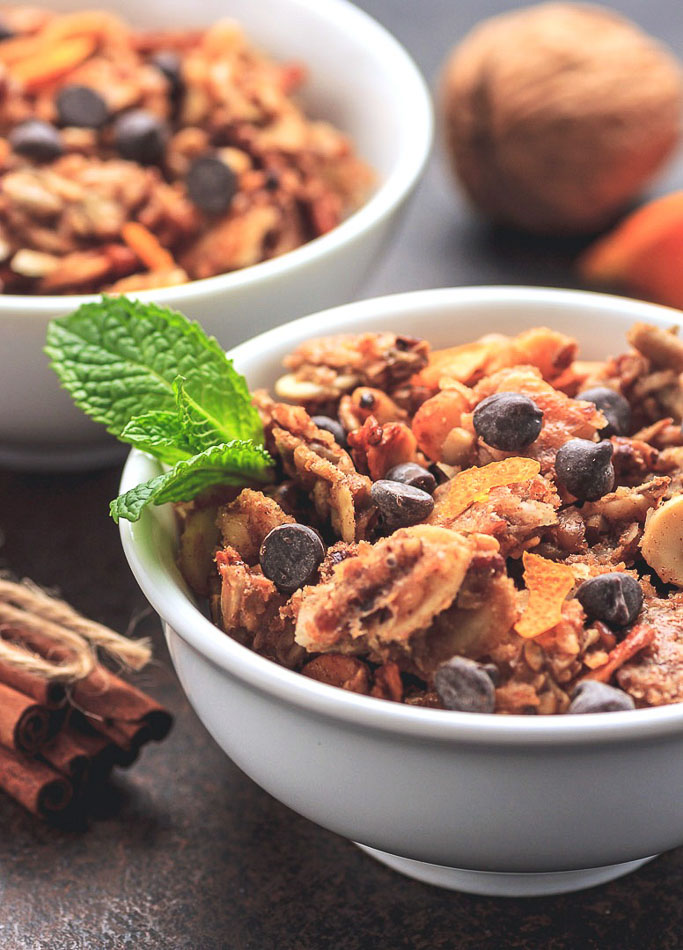 Crunchy low carb granola with sugar-free chocolate chips and orange accents.