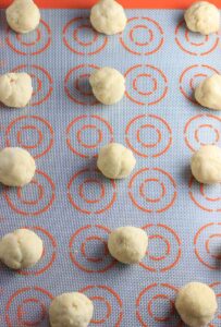 place cookie dough balls on baking sheet