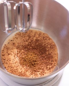 Mixing cream, coffee and cocoa powder