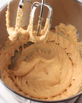 Mixing the pumpkin cream cheese together.