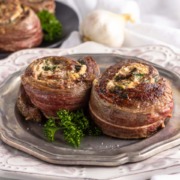Two spinach cheese stuffed flank steak rolls.