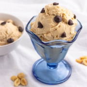 Two bowls of peanut butter frozen yogurt with chocolate chips on top.