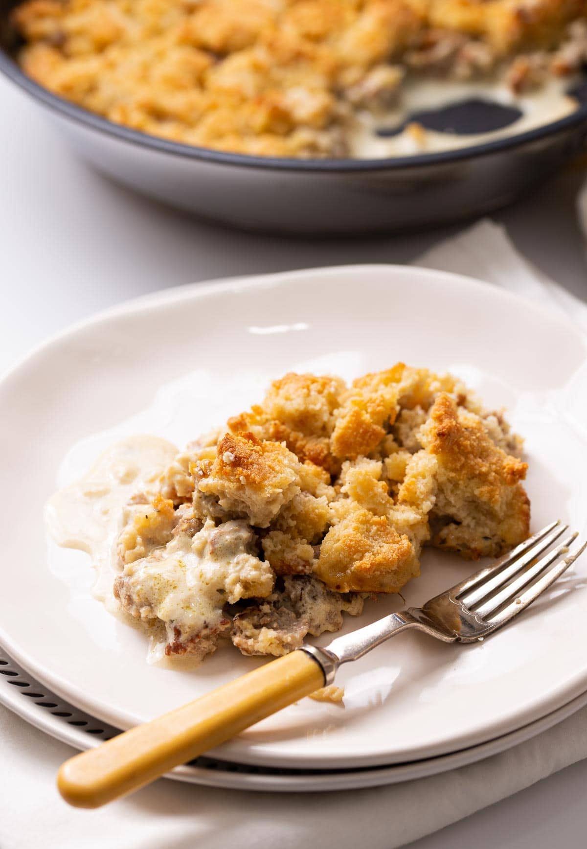 Low car biscuit crumble over sausage and gravy.